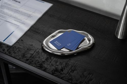 a silver lap top with blue cards in it on a table at Maison Bruges in Bruges