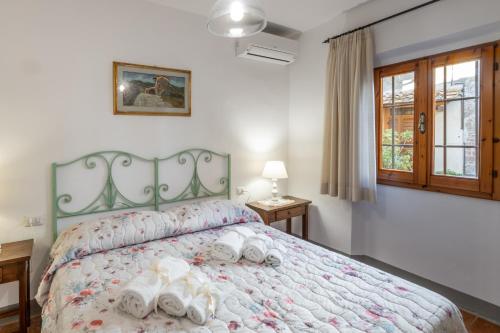 Postel nebo postele na pokoji v ubytování Agriturismo Poggio Nardini