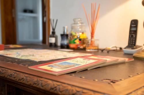 a book sitting on top of a wooden table at 2 Passi Da in Rome