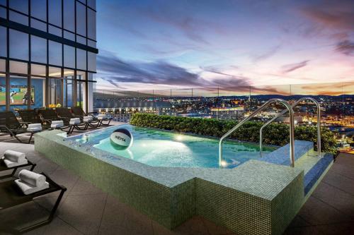 a hot tub on top of a building at Seaport studio w fitness close to shops dining BOS-990 in Boston