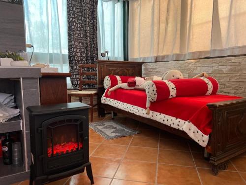 a bedroom with a bed with a fire place at Villa Venturini in Trecase