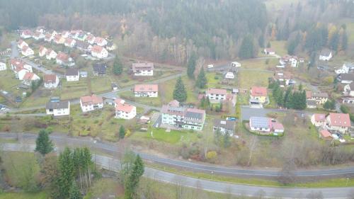 an aerial view of a town with houses and a highway at Gruppenferienhaus Dressel in Warmensteinach