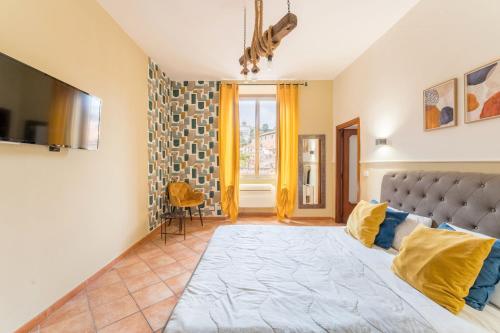 a bedroom with a large bed with yellow pillows at FL Apartments Al Mattonato n4 in Rome