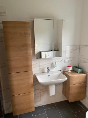 a bathroom with a sink and a mirror at Ferienhaus Paula in Marlow