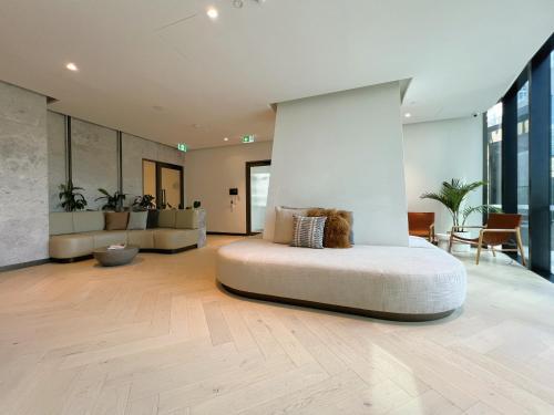 a bedroom with a large bed in the middle of a room at 1 BRM 1 BATH, Southern Cross Station, Flagstaff in Melbourne