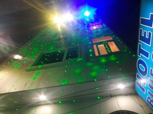 a basketball court with green lights on top of a building at New hotel blue stars in Varanasi