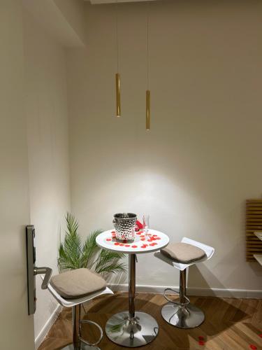 a small table in a room with two chairs at Hotel Due Pini Conte in Angri