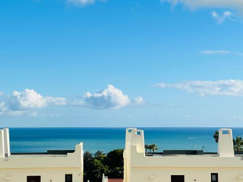 a view of the ocean from a building at Panorama 1 in Albufeira