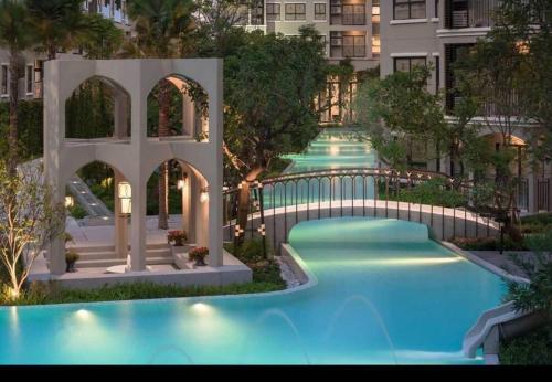 an overhead view of a swimming pool at night at HuaHin La Casita condo Quiet, bright room with nice view Netflix vip #2 in Hua Hin
