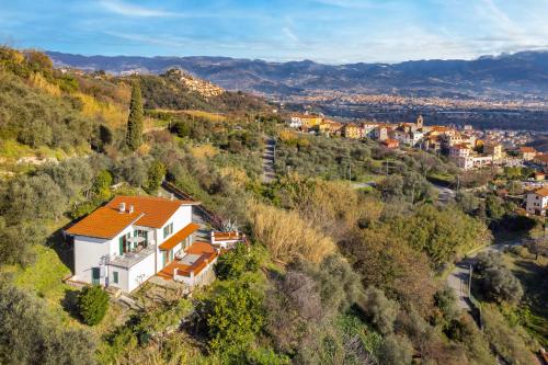 an aerial view of a house on a hill at Castellara Green House - Colline di Lerici in Arcola