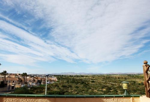 a view of the desert under a cloudy sky at Bungalow Gran Alacant in Gran Alacant