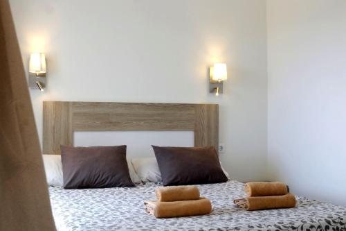Ένα ή περισσότερα κρεβάτια σε δωμάτιο στο Apartamentos Juan Benítez