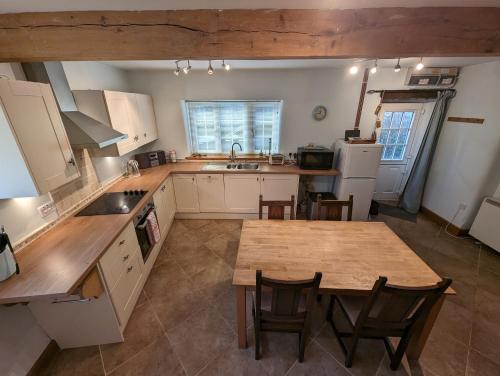 Η κουζίνα ή μικρή κουζίνα στο Mews Cottage