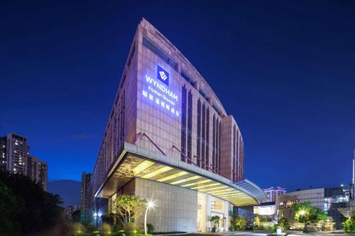 a building with a sign on the side of it at Wyndham Foshan Shunde in Shunde