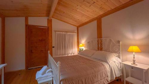 Postel nebo postele na pokoji v ubytování Agriturismo 4 Ricci
