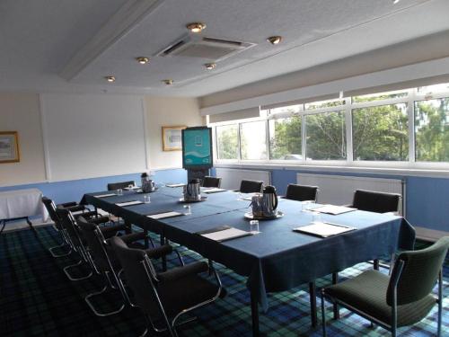 a conference room with a long table and chairs at Ox Hotel Carlisle in Carlisle
