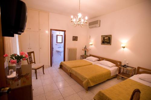 Postel nebo postele na pokoji v ubytování Hotel Urania