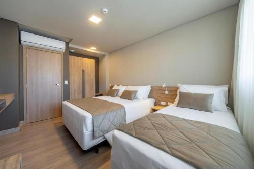 Krevet ili kreveti u jedinici u okviru objekta Laghetto Resort Golden Oficial - Particular