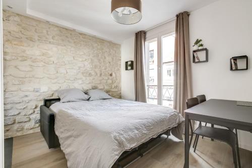 Postel nebo postele na pokoji v ubytování Volontaire