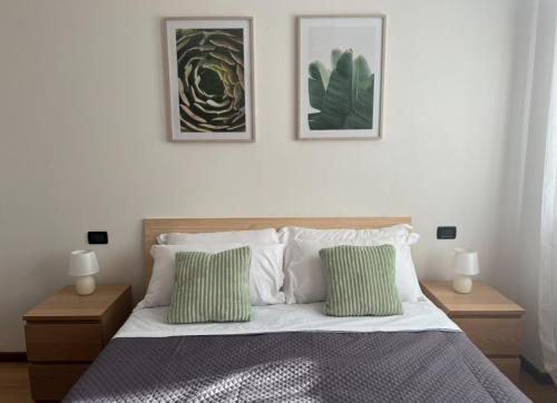 Ένα ή περισσότερα κρεβάτια σε δωμάτιο στο PAO Apartment - Borgo Milano