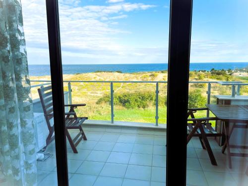 a balcony with a view of the ocean at Apart-Hotel Panorama Sea LUX in Primorsko