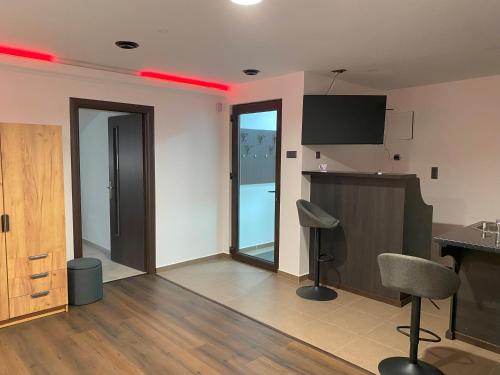 a living room with red lights on the wall at Casa Sofia in Satu Mare