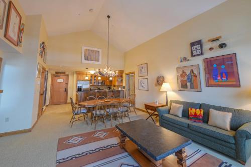a living room with a couch and a table at The Lodge at Mountaineer Square in Mount Crested Butte