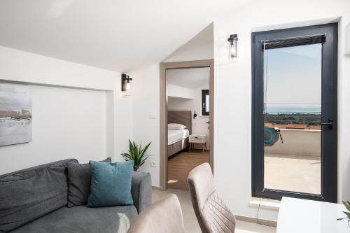 Postel nebo postele na pokoji v ubytování Apartments Sara III