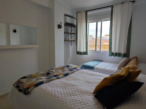 Giường trong phòng chung tại Fuengirola Central