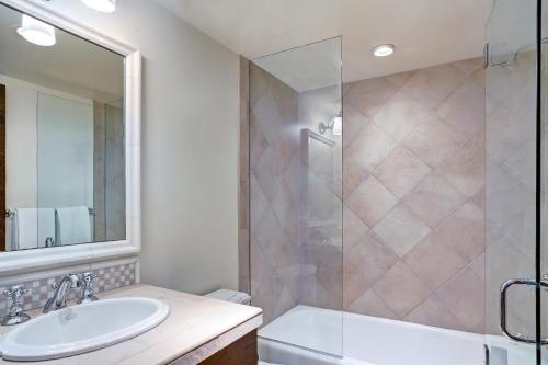 a bathroom with a sink and a shower at Lodge at Vail, A RockResort in Vail