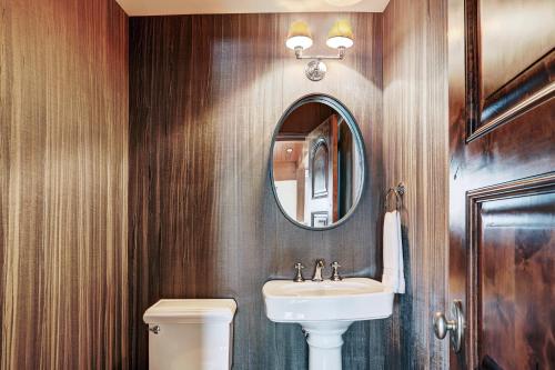 a bathroom with a sink and a mirror at Lodge at Vail, A RockResort in Vail