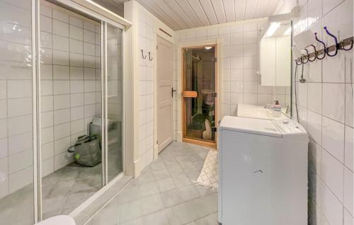 a bathroom with a sink and a washing machine at Stunning Apartment In Beitostlen With Kitchen in Beitostøl