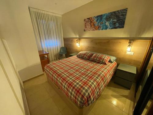 Un pat sau paturi într-o cameră la Apartamento entero Viento del Norte