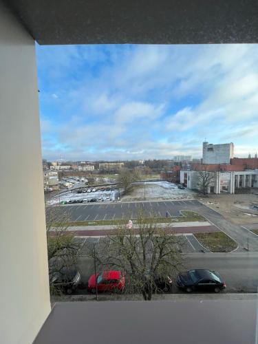 a view of a parking lot with cars parked at Forentinn Kranto 43 in Panevėžys