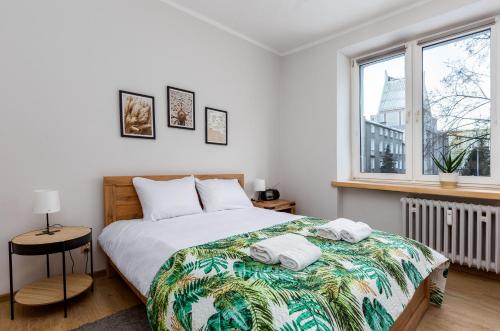מיטה או מיטות בחדר ב-Marina Comfort Apartment