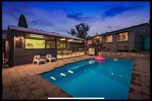 a swimming pool in the backyard of a house at Resort style home pool spa sauna in Phillip