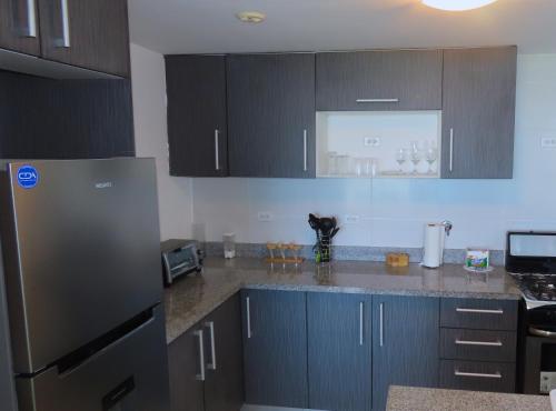 Una cocina o cocineta en PlayaBlanca Ocean Blue "Vista al Mar"