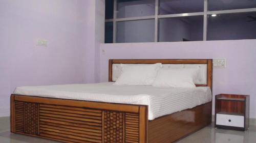 Ένα ή περισσότερα κρεβάτια σε δωμάτιο στο HOTEL GOLDEN BUDDHA INN