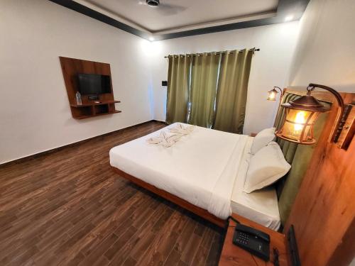 Rashiva Resort房間的床