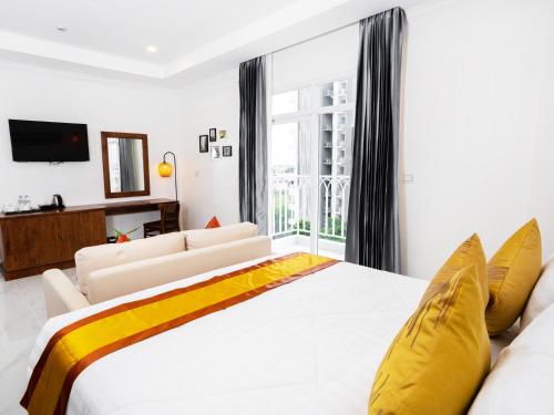 Postel nebo postele na pokoji v ubytování Le Kree Downtown Hotel