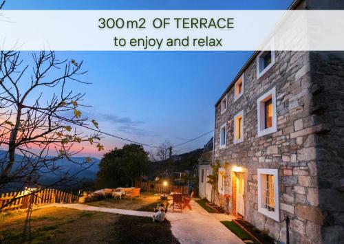 a picture of a stone house with the words of terrace to enjoy at Stone house with amazing view in Črni Kal