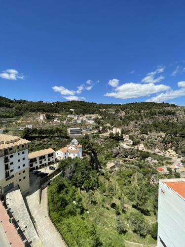 una vista aérea de una ciudad con edificios y árboles en Holiday apartment in Lucena del Cid Bajo B Ref 047, en Lucena del Cid