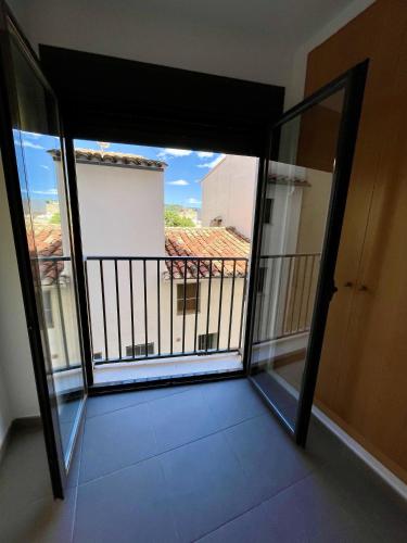 an open balcony with a view of a building at Apartamento vacacional en Lucena del Cid - Bajo C Ref 048 in Lucena del Cid
