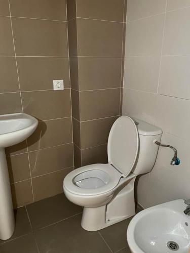 a bathroom with a toilet and a sink at Holiday appartement in Lucena del Cid- Basement A Ref 049 in Lucena del Cid