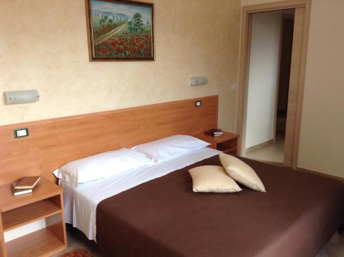 Ένα ή περισσότερα κρεβάτια σε δωμάτιο στο B&B Il Giardino di Zefiro