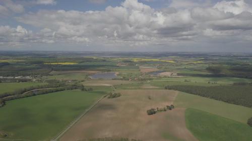 an aerial view of a field and a river at Ferienwohnung `Schwanennest in Federow