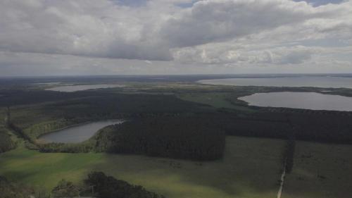 an aerial view of a group of lakes and forests at Ferienwohnung `Schwanennest in Federow