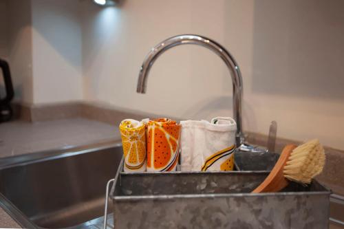 a kitchen sink with several pairs of shoes in it at higgihaus Cabot Mews #36 Fantastic Central Location in Bristol