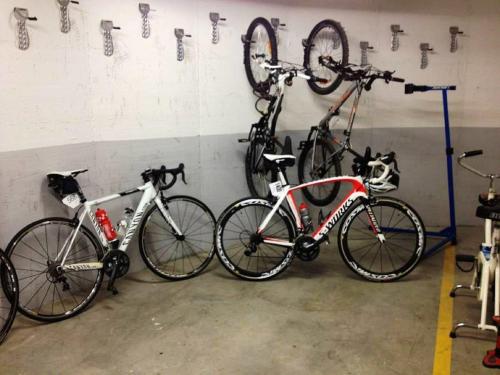 two bikes parked next to each other in a garage at Hotel Villa Paulita in Puigcerdà