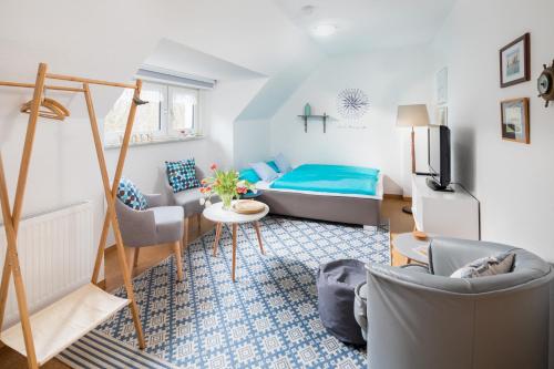 Ένα ή περισσότερα κρεβάτια σε δωμάτιο στο Himmelsrichtung